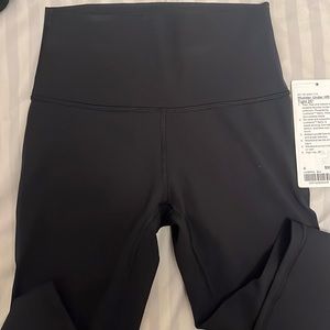 Lululemon black wunder under tights in a size 4 length 25